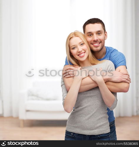 love and family concept - smiling couple hugging