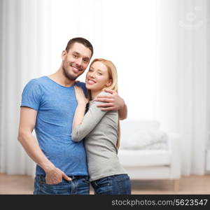 love and family concept - smiling couple hugging