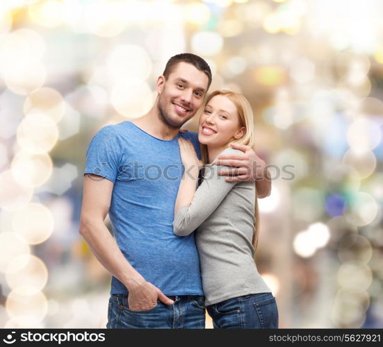 love and family concept - smiling couple hugging