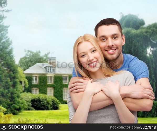 love and family concept - smiling couple hugging