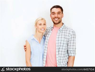 love and family concept - smiling couple hugging. smiling couple hugging