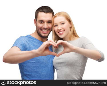 love and family concept - smiling couple showing heart with hands