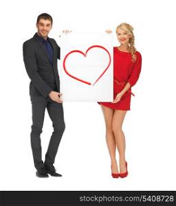 love and happiness concept - smiling couple holding big white board with heart