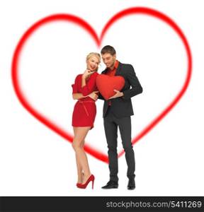 love and relationship concept - beautiful couple holding big heart