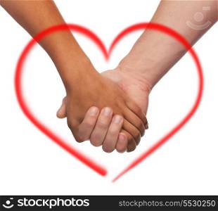 love and relationships concept - closeup of woman and man holding hands