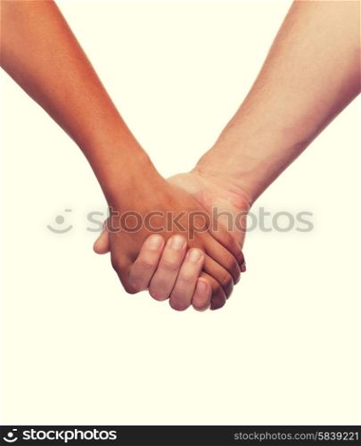 love and relationships concept - closeup of woman and man holding hands. woman and man holding hands