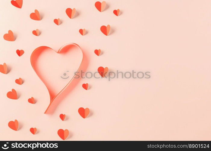 Love and Valentines Day background. Top view flat lay of Ribbons shaped as heart and paper elements cutting red hearts flying on pink background, Banner template greeting card design of holiday