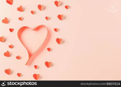 Love and Valentines Day background. Top view flat lay of Ribbons shaped as heart and paper elements cutting red hearts flying on pink background, Banner template greeting card design of holiday