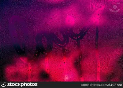 Love background, dark bright pink photo of a wet window with raindrops on it and handwriting word love, passion and desire concept, greeting card for Valentines day holiday. Love background