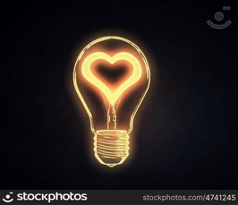 Love concept. Lightbulb with glowing heart inside onn dark background