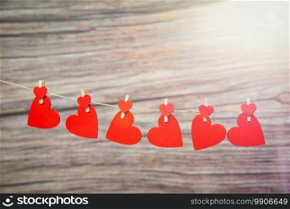 Love concept, red hanging hearts on wooden background for Valentines Day, Mothers Day, Womans day,romantic design copy space space for text. Love concept, red hanging hearts on wooden background for Valentines Day, Mothers Day, Womans day,romantic design copy space