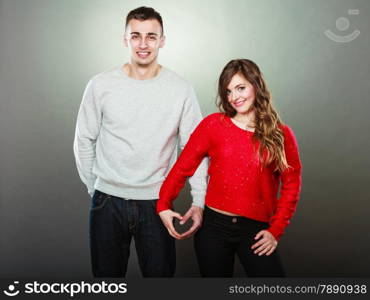 Love concept. Woman and man hands forming heart shape with their fingers