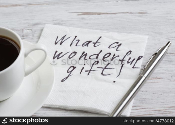 Love confession on napkin. Romantic message written on napkin and cup of coffee on wooden table