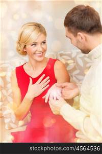 love, couple, relationship and dating concept - romantic man proposing to a woman in red dress