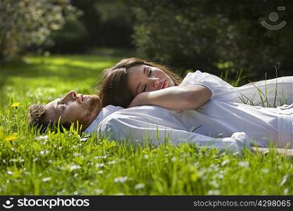 Love couple relaxing in a park