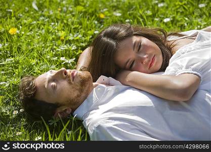 Love couple relaxing in a park