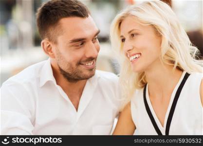 love, date, affection, people and relations concept - smiling happy couple outdoors