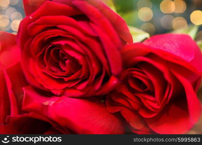 love, date, flowers, valentines day and holidays concept - close up of red roses bunch