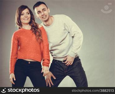 Love dating and people concept. Smiling young couple look to empty copy space ,instagram filter