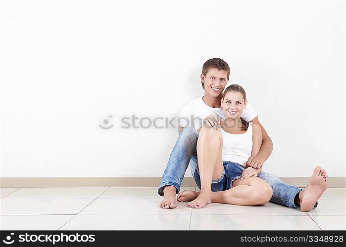Love embracing couple on the floor