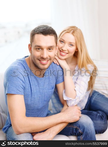 love, family and happiness concept - smiling happy couple at home