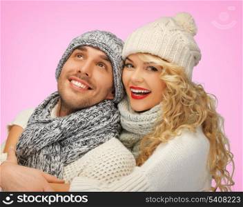 love, family and holidays concept - romantic couple in winter clothes