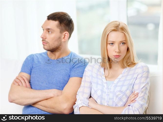 love, family and relationship problems concept - unhappy couple not speaking after having argument at home
