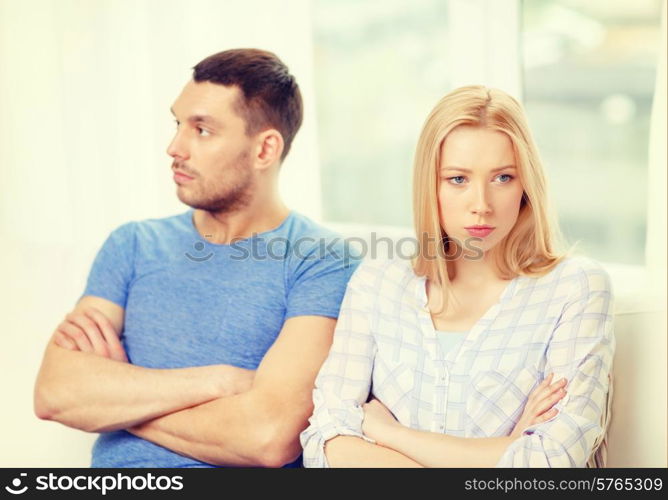 love, family and relationship problems concept - unhappy couple not speaking after having argument at home