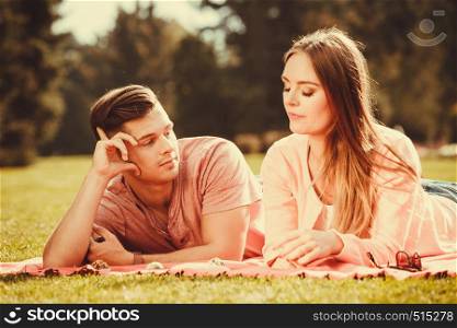 Love food and happiness. Smiling joyful cute couple on picnic in garden park. Happy lovers dating on fresh air.. Couple on picnic date outdoor.