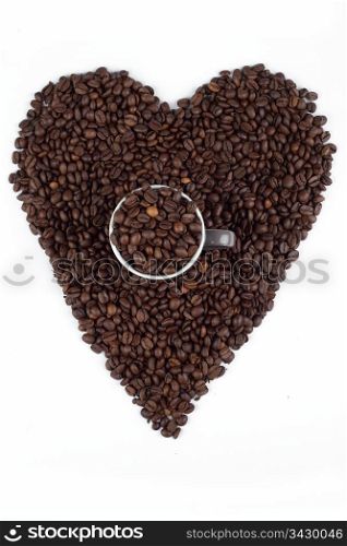 Love for coffee beans. a heart sign made out of coffee beans with a cup or mug full of beans in the middle