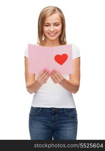 love, holidays and happiness concept - smiling girl with postcard