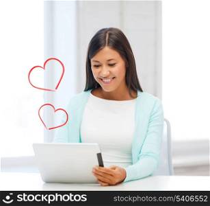 love, home, new technology and internet concept - smiling woman with tablet pc