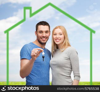 love, home, people and family concept - smiling couple holding house key over green house and blue sky with grass background