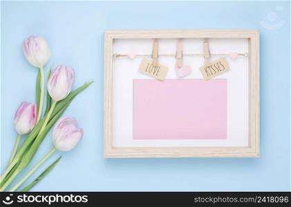 love kisses inscription frame with tulip flowers