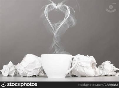 love letter. crumpled wads and heart silhouette on gray