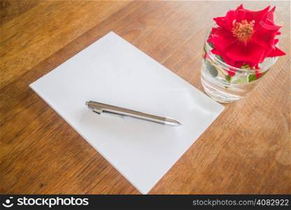 Love letter paper on wooden table, stock photo