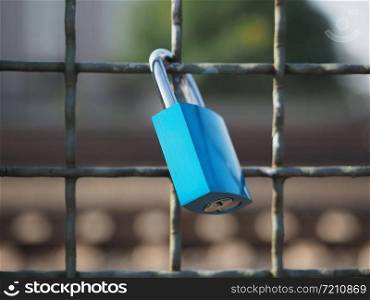 Love lock padlock locked to a bridge fence. Love lock padlock