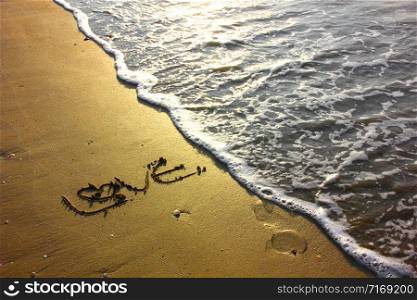 love on beach with sun light ,sea wave