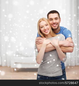 love, people and family concept - smiling couple hugging at home