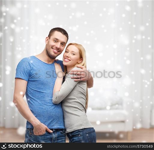 love, people and family concept - smiling couple hugging at home