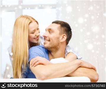 love, people and family concept - smiling couple hugging at home
