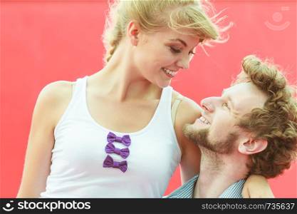 Love relationship and dating concept. Young couple on date having fun outdoor on red . couple lovers dating outdoor
