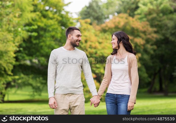 love, relationship, family and people concept - happy couple dating in summer park