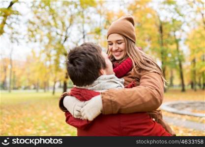 love, relationships, season and people concept - happy young couple meeting in autumn park