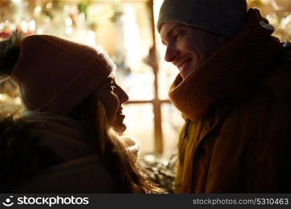 love, romance and people concept - close up of happy couple in winter closes. close up of happy couple in winter closes