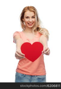 love, romance, charity, valentines day and people concept - smiling young woman or teenage girl with blank red heart shape