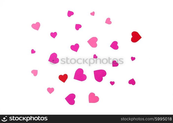 love, romance, valentines day and holidays concept - close up of red and pink heart shapes