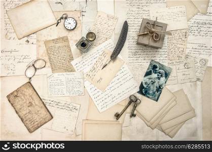 love story. old letters, vintage postcards and antique feather pen. nostalgic sentimental background with retro picture of couple