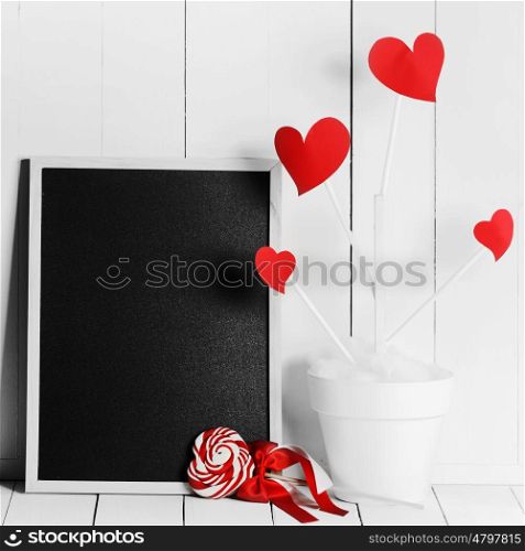 Love tree in flower pot. Love tree with red heart shaped leaves in white flower pot and blackboard with copy space