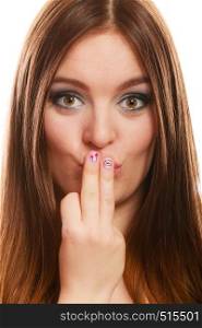 Love valentines day concept. Funny girl covers her mouth with hand showing pink emotional heart nails design on white